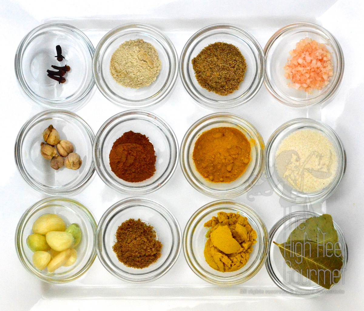 Top from left to right: Clove, White Pepper, Ground Coriander, Himalayan Salt Middle: White Cardamom, Cinnamon powder, Turmeric powder, Granulated Sugar Bottom: Garlic, Ground Cumin, Curry powder, Bay leaf