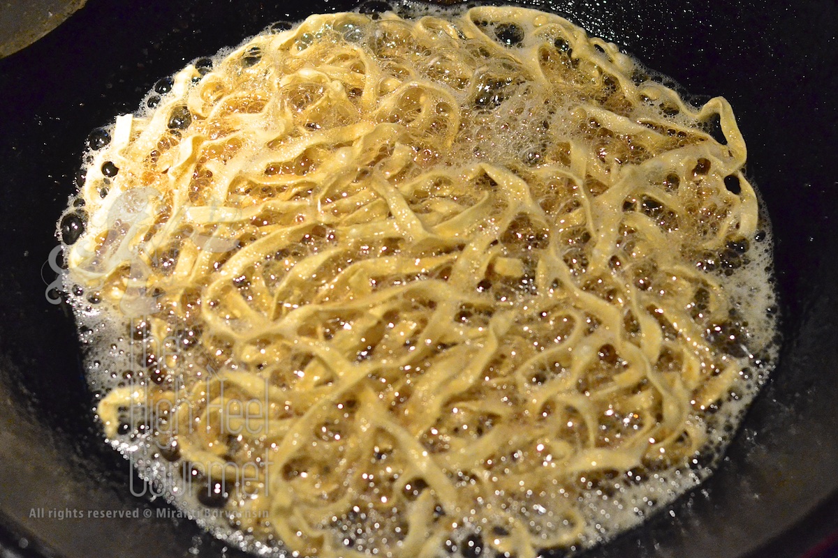 Fry them in small batch at a time in a very hot oil set over high heat. 